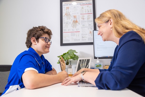 A Lime Therapy Hand therapist helping a client.