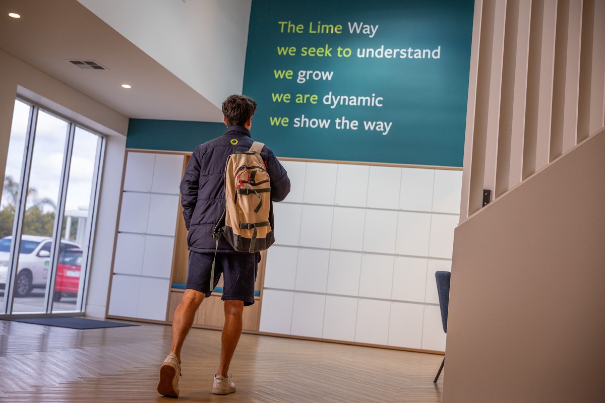 Photo of person ready The Lime Way signage.